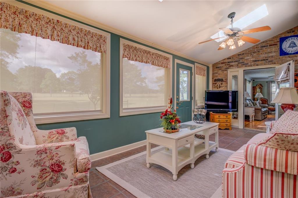 740 Smyrna Road Southwest Conyers, GA 30094 - Photo 20 of 50 a living room with furniture and a large window