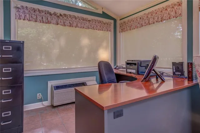 a bedroom with bed and window