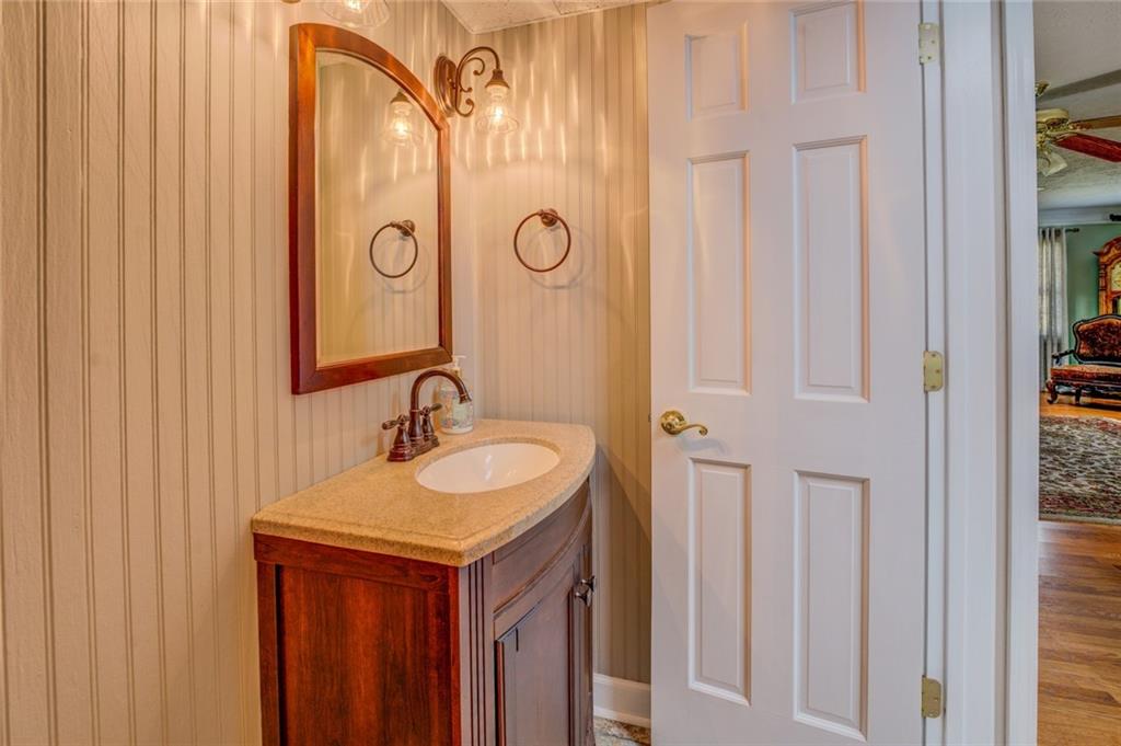 740 Smyrna Road Southwest Conyers, GA 30094 - Photo 23 of 50 a bathroom with a sink and a mirror