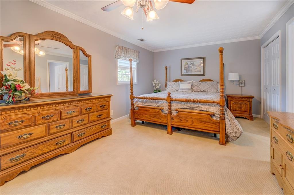 740 Smyrna Road Southwest Conyers, GA 30094 - Photo 24 of 50 a bedroom with bed and window