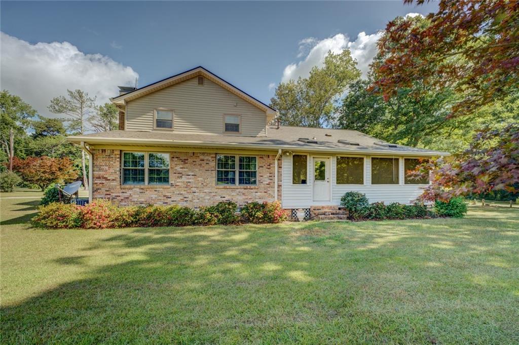 740 Smyrna Road Southwest Conyers, GA 30094 - Photo 38 of 50 front view of a house and a yard