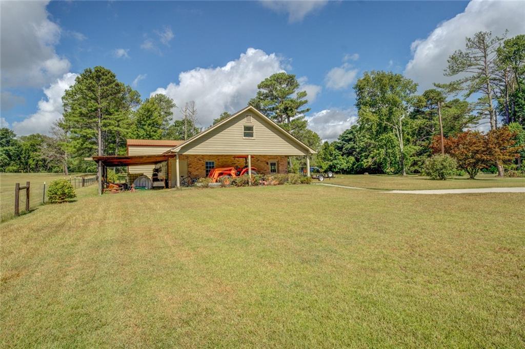 740 Smyrna Road Southwest Conyers, GA 30094 - Photo 46 of 50 a house with swimming pool in front of it