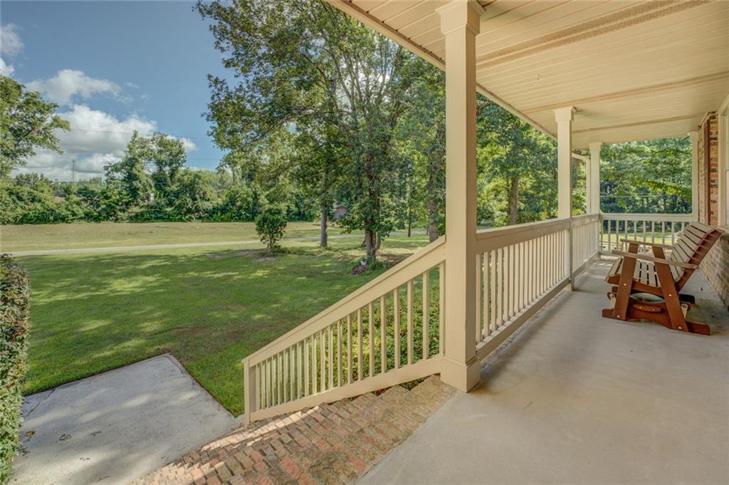 740 Smyrna Road Southwest Conyers, GA 30094 - Photo 6 of 50 a view of a two chair in the balcony next to a yard