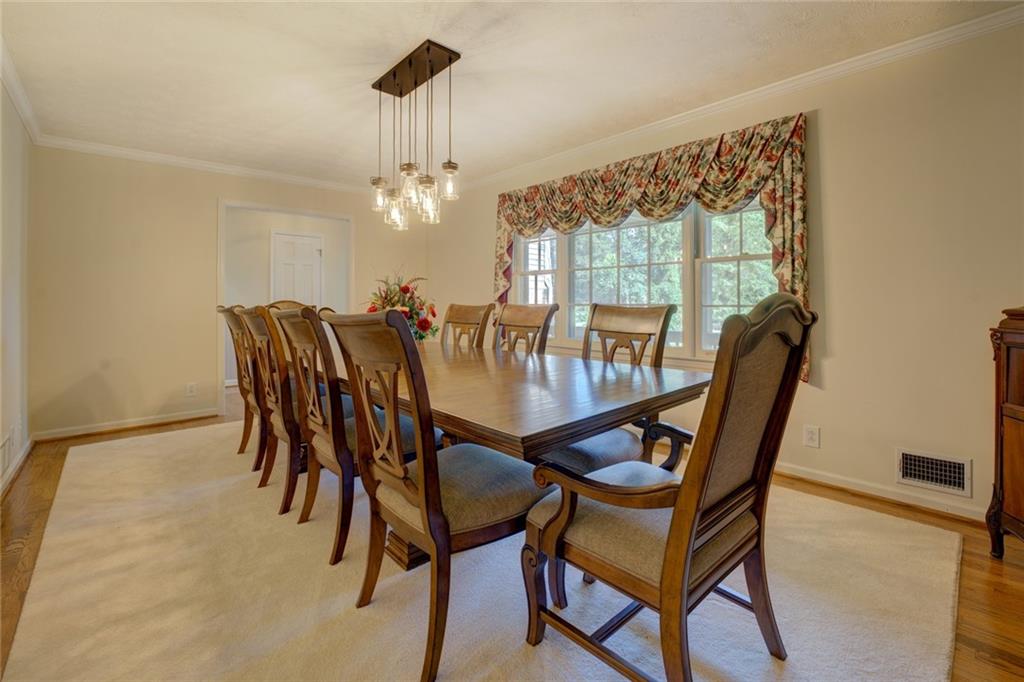 740 Smyrna Road Southwest Conyers, GA 30094 - Photo 8 of 50 a view of a dining room with furniture window and outside view