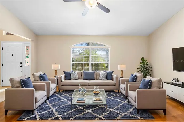a living room with furniture and a large window