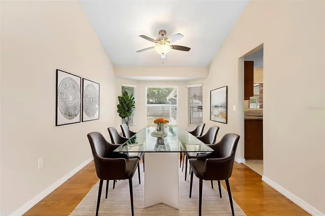 a view of a dining room with furniture and wooden floor