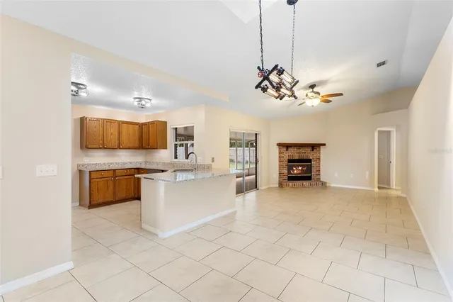 a kitchen with stainless steel appliances granite countertop a refrigerator and a stove