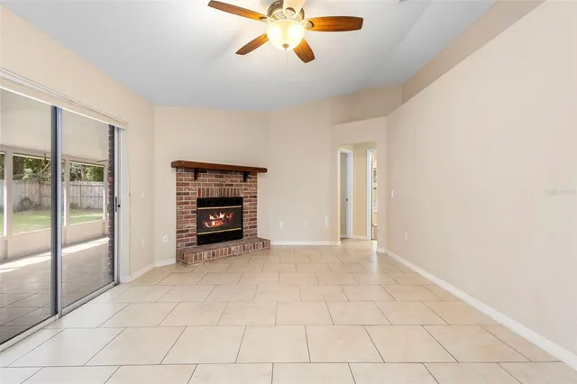 a view of an empty room and fire place