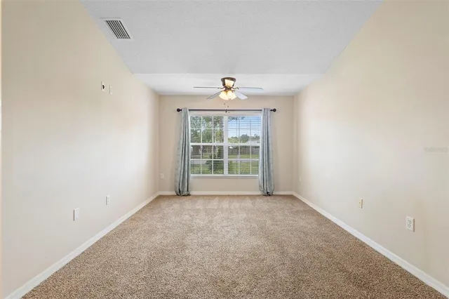 a view of an empty room and window