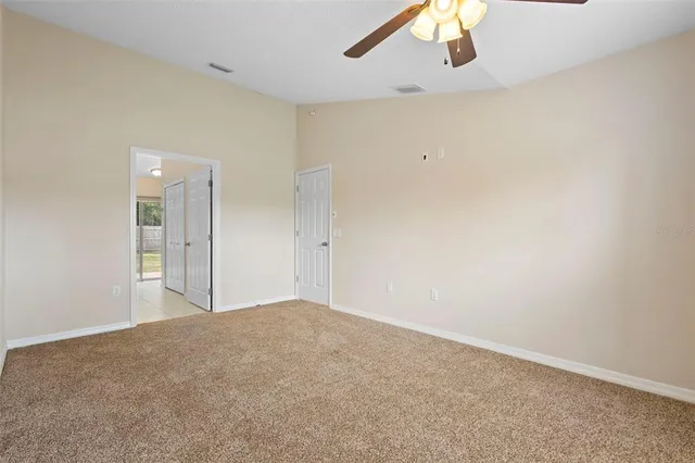 a bathroom with a tub a sink and mirror