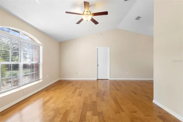 a view of an empty room with a window