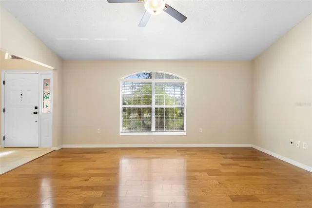 an empty room with a empty space and a window