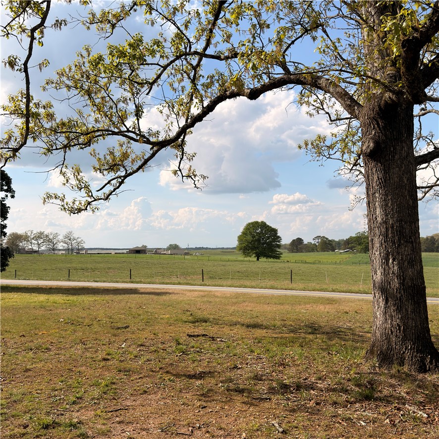 1014 Levis Smith Road Pendleton, SC 29670 - Photo 11 of 21 This expansive rural landscape offers scenic tranquility and open pastures under a vast sky.