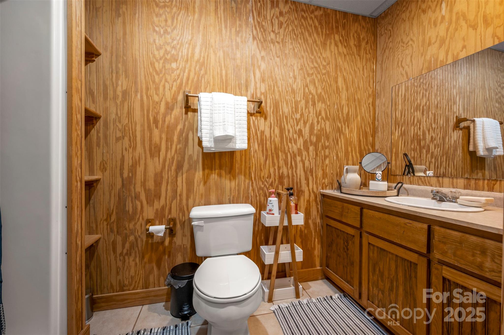 1168 Grays Creek Church Road Rutherfordton, NC 28139 - Photo 29 of 47 a bathroom with a toilet a sink and mirror