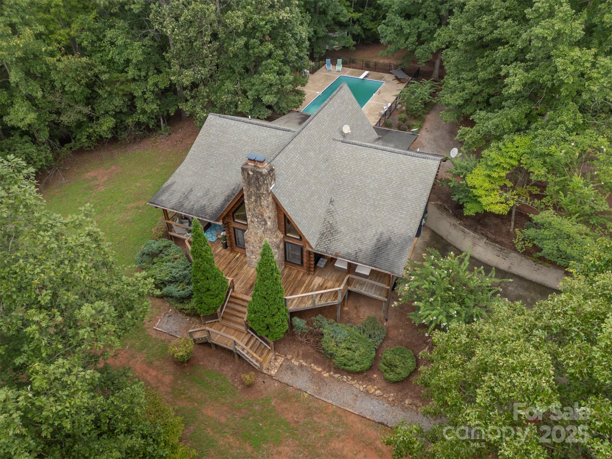 1168 Grays Creek Church Road Rutherfordton, NC 28139 - Photo 3 of 47 an aerial view of a house with a yard and lake view