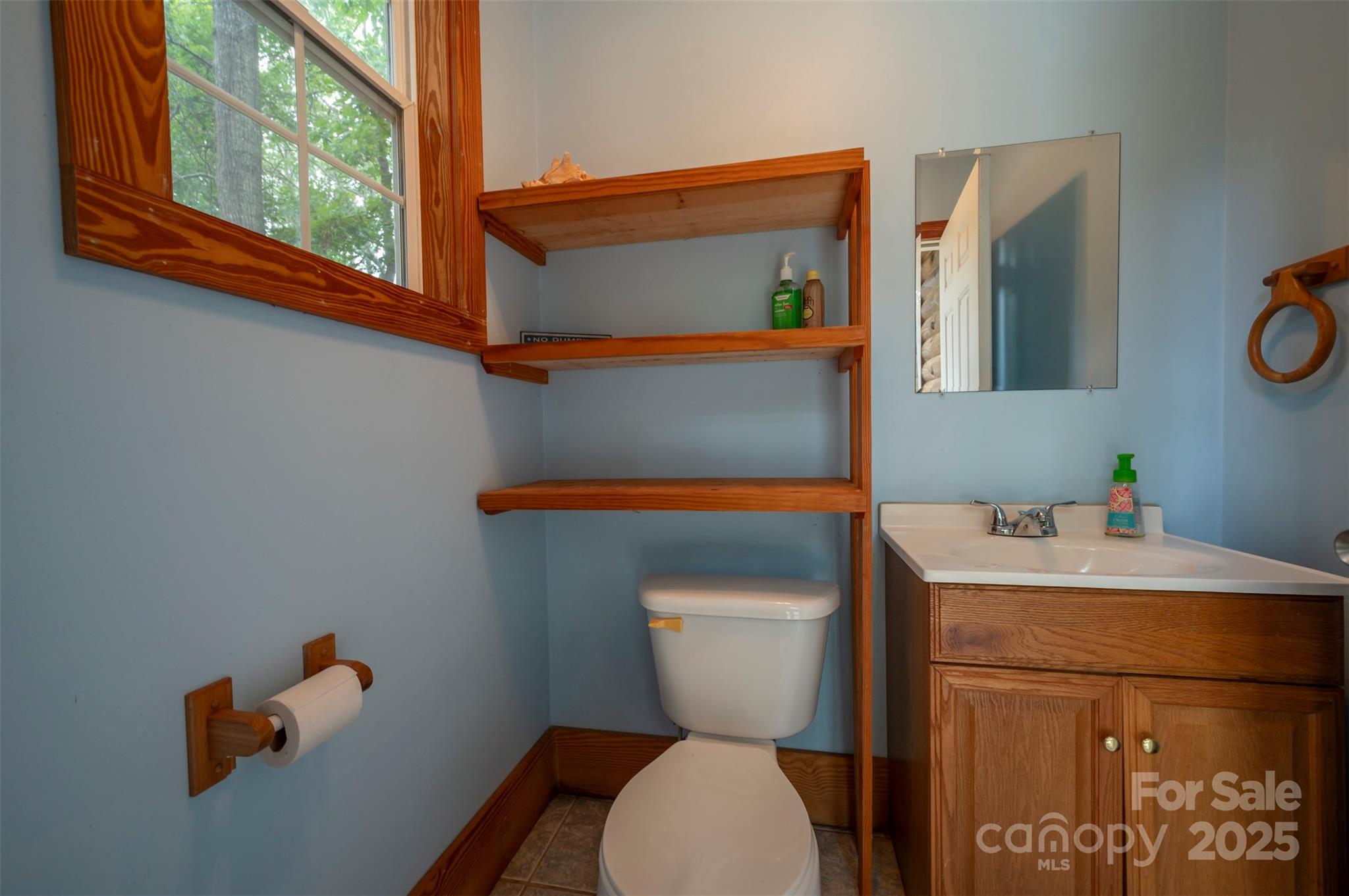 1168 Grays Creek Church Road Rutherfordton, NC 28139 - Photo 38 of 47 a bathroom with a toilet sink and mirror