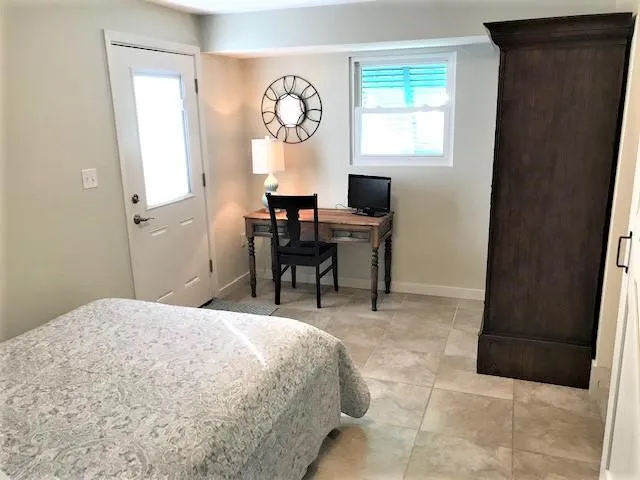 a bed room with a bed and a window