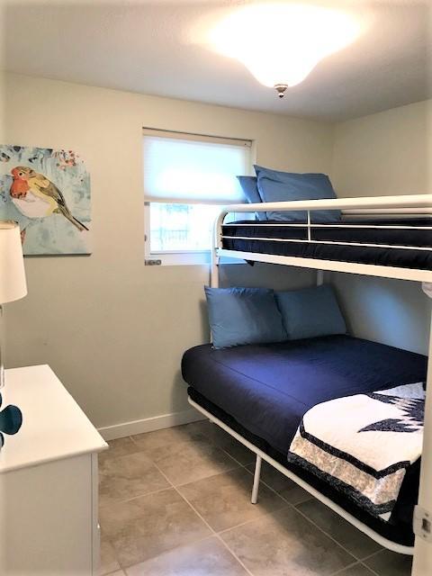 244 Hilltop Drive Santa Rosa Beach, FL 32459 - Photo 16 of 20 a room with a chair and a table