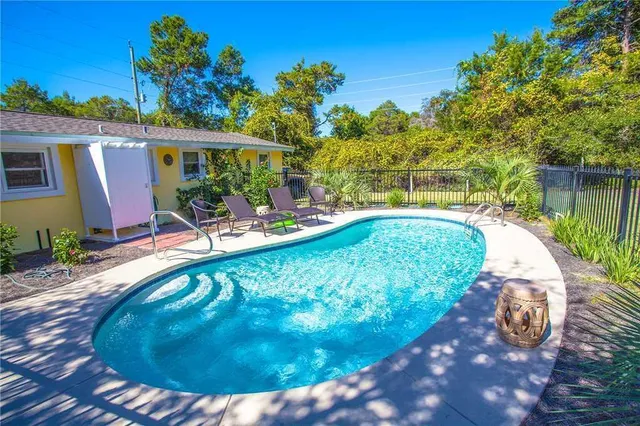 a view of a swimming pool with a patio