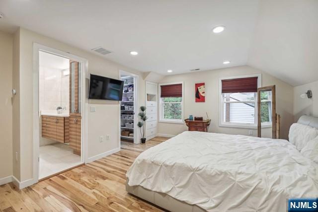 19 Center Street Cresskill, NJ 07626 - Photo 11 of 21 a large bedroom with bed and tv