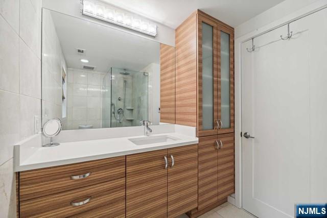 19 Center Street Cresskill, NJ 07626 - Photo 13 of 21 a bathroom with a sink and a mirror