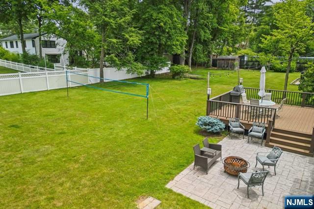 19 Center Street Cresskill, NJ 07626 - Photo 18 of 21 a view of a chair and table in the garden
