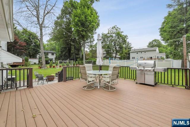19 Center Street Cresskill, NJ 07626 - Photo 20 of 21 a view of a chairs and table on the wooden deck