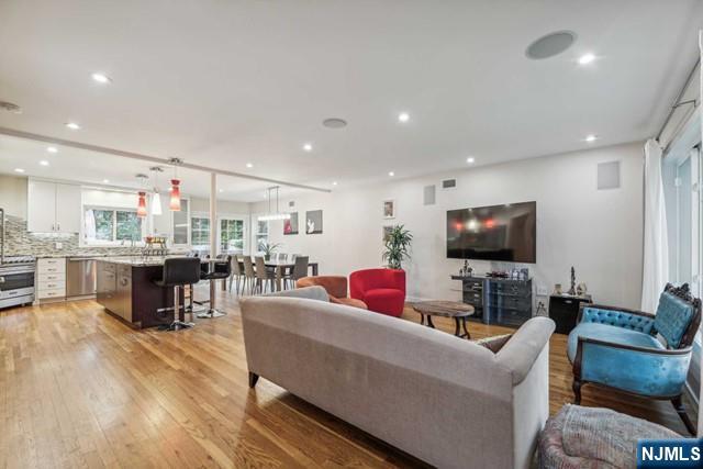 19 Center Street Cresskill, NJ 07626 - Photo 3 of 21 a living room with furniture and a flat screen tv