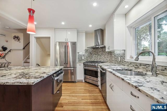 19 Center Street Cresskill, NJ 07626 - Photo 4 of 21 a kitchen with stainless steel appliances granite countertop a sink stove and refrigerator