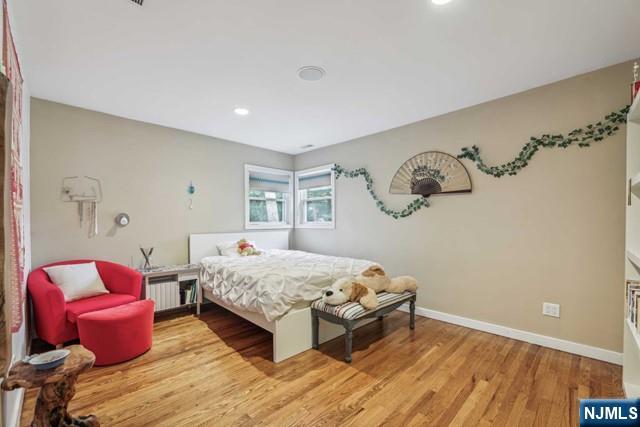 19 Center Street Cresskill, NJ 07626 - Photo 6 of 21 a bedroom with a bed and a table