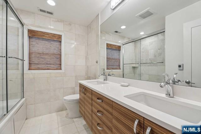19 Center Street Cresskill, NJ 07626 - Photo 9 of 21 a bathroom with a double vanity sink toilet and shower