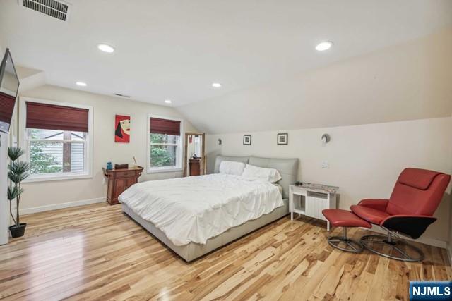 19 Center Street Cresskill, NJ 07626 - Photo 10 of 21 a spacious bedroom with a bed and a couch