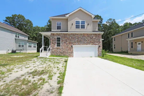 a large kitchen with stainless steel appliances lots of counter top space
