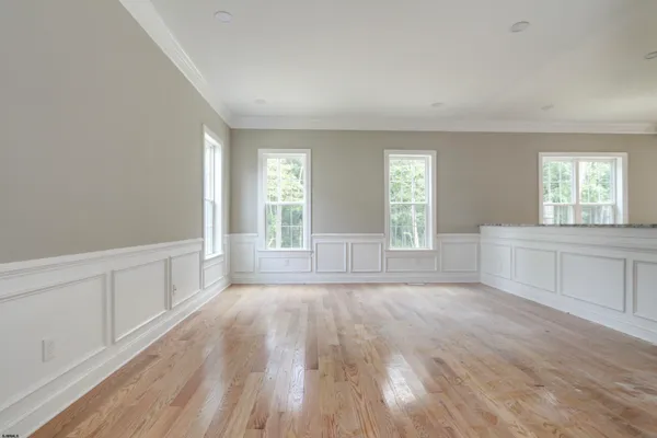 a view of a kitchen cabinets and wooden floor