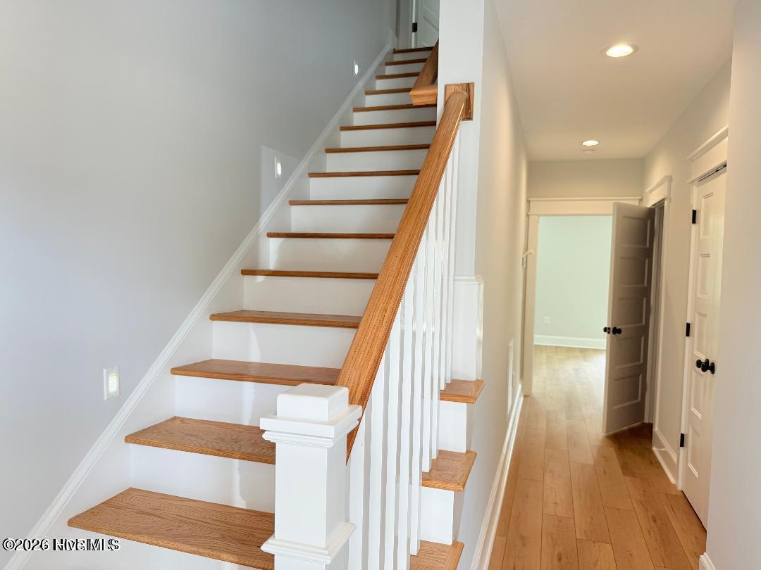 116 Hardwick Lane Newport, NC 28570 - Photo 8 of 74 Bottom Level Hallway and Stairs