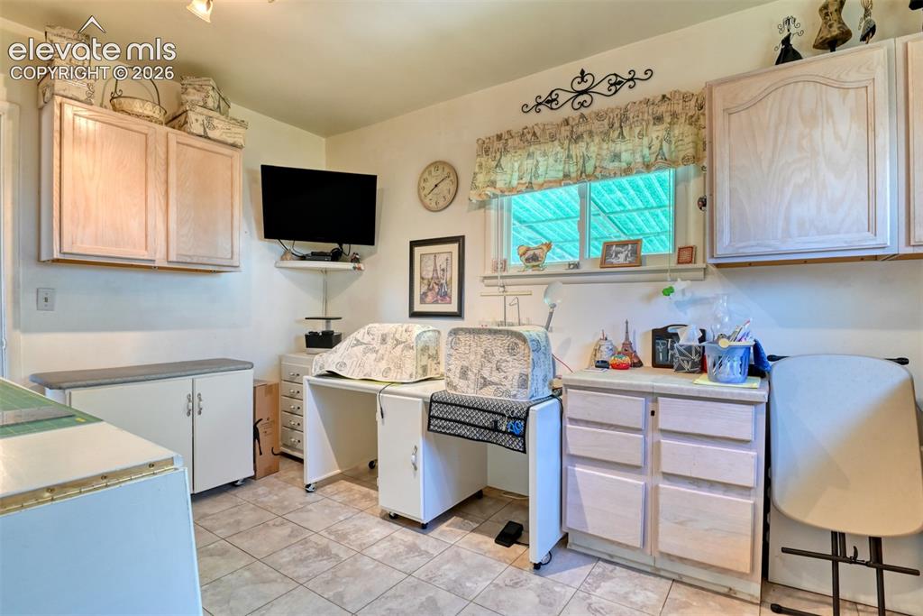 22558 Enoch Road Calhan, CO 80808 - Photo 36 of 50 a kitchen with a stove and a microwave