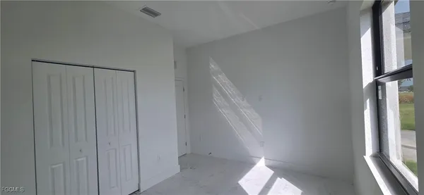 a view of hallway with windows