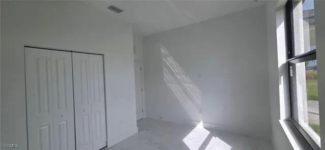 a view of hallway with windows