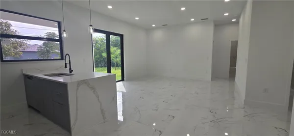a bathroom with a sink and mirror