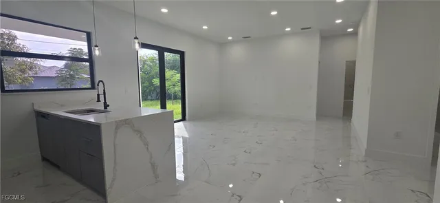 a bathroom with a sink and mirror