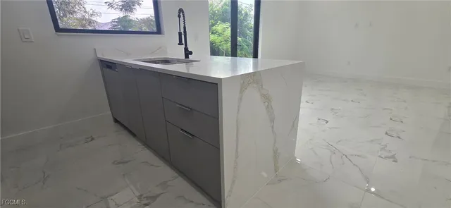 a bathroom with a sink and mirror