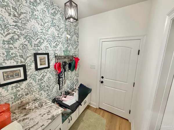 a room with table and flowerpot