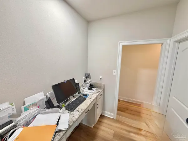 a view of workspace with wooden floor