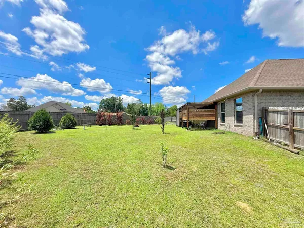 a front view of a house with a big yard