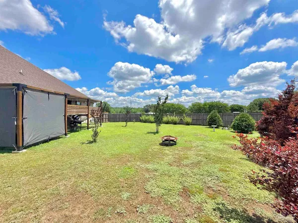 a view of a playground with basketball court