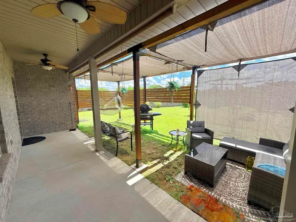 a outdoor space with lots of furniture and windows