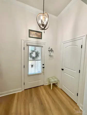 a view of an empty room with a fireplace and a window