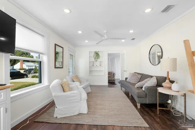 a living room with fireplace furniture and a flat screen tv
