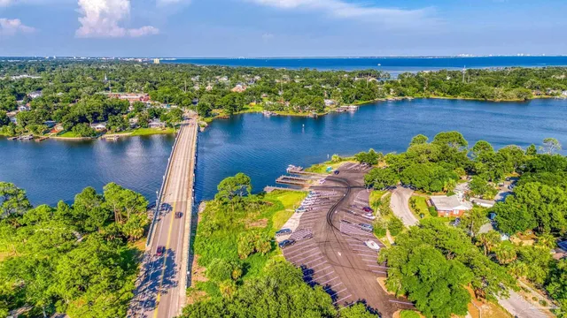an aerial view of a houses with a lake view