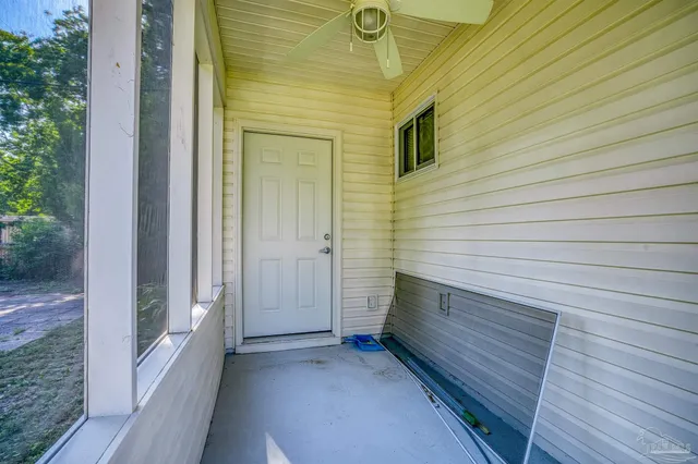 a view of a door and wooden floor